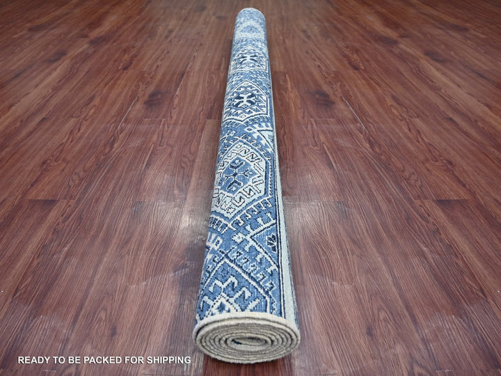 Handmade Kazak area rug in showroom