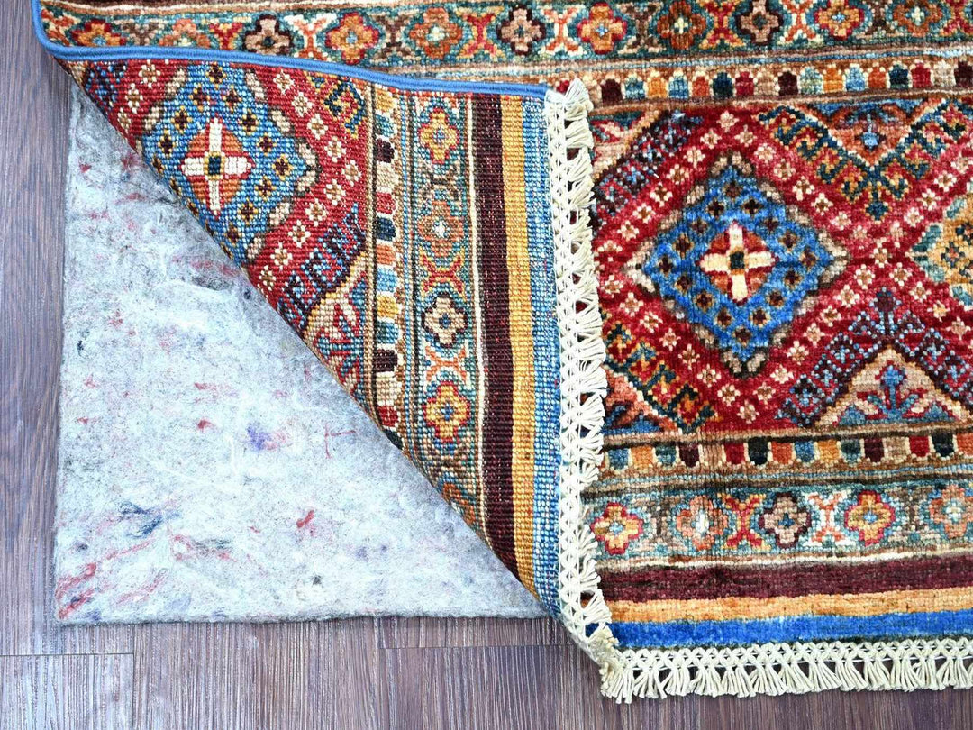 Handmade Kazak area rug in showroom
