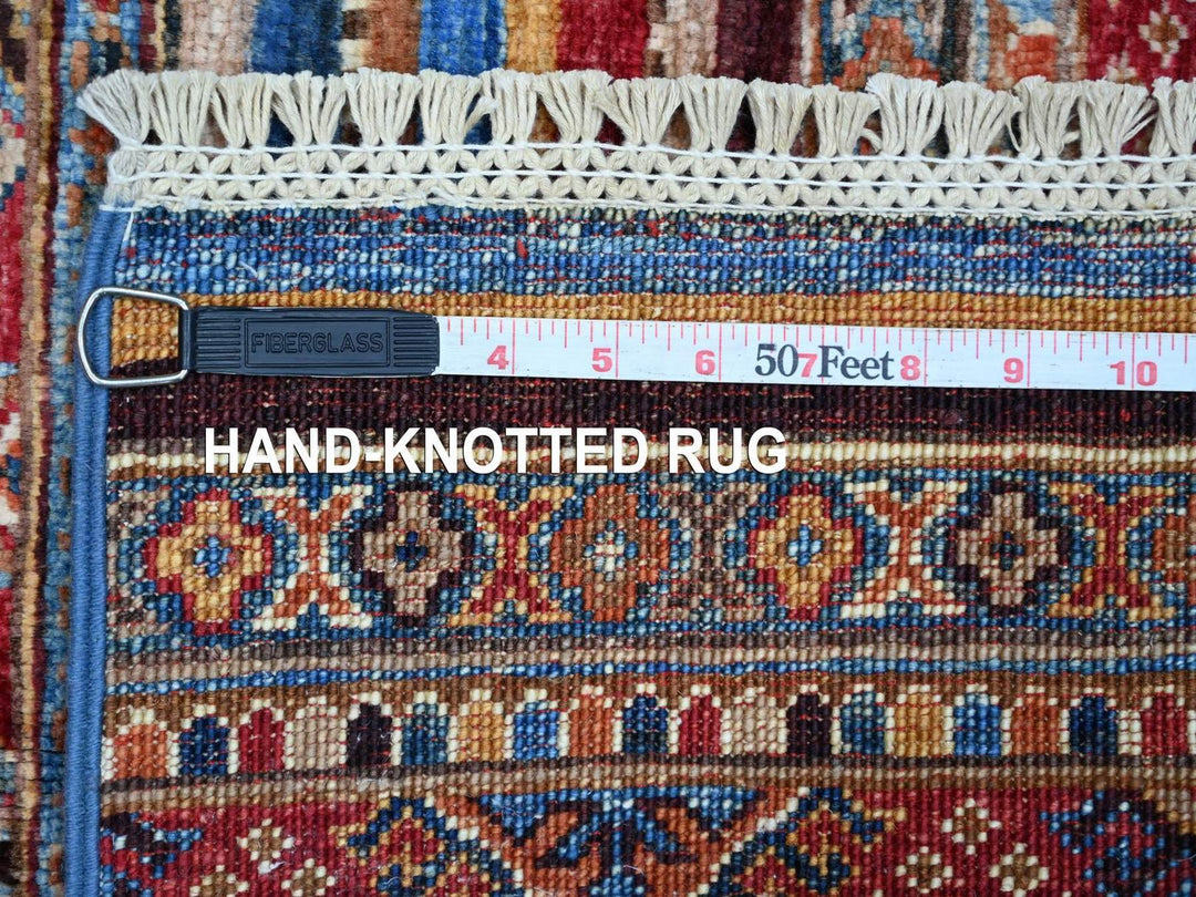 Traditional Kazak rug with geometric design